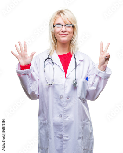 Young beautiful blonde doctor woman wearing medical uniform over isolated background showing and pointing up with fingers number seven while smiling confident and happy.