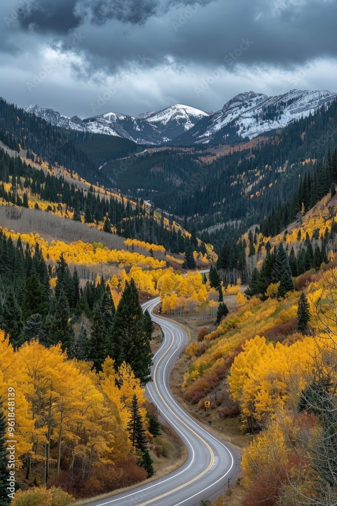 A winding road in the mountains with autumn foliage