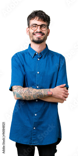 Young handsome man wearing glasses over isolated background happy face smiling with crossed arms looking at the camera. Positive person.