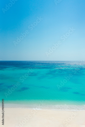 Beautiful tropical beach. Sea waves white sand, turquoise ocean against sunny blue sky clouds happy summer day. summer background and summer holiday concept.