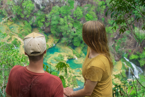 Couple at the view from the top of  Semuc Champey in Guatemala photo