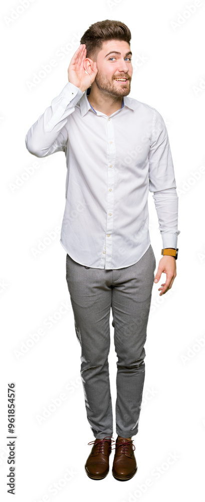 Young handsome business man smiling with hand over ear listening an hearing to rumor or gossip. Deafness concept. Young handsome business man smiling with hand over ear listening an hearing to rumor or gossip. Deafness concept.