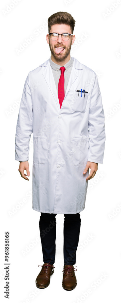 Young handsome scientist man wearing glasses sticking tongue out happy with funny expression. Emotion concept. Young handsome scientist man wearing glasses sticking tongue out happy with funny expression. Emotion concept.