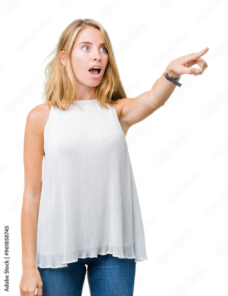 Beautiful young elegant woman over isolated background Pointing with finger surprised ahead, open mouth amazed expression, something in front Beautiful young elegant woman over isolated background Pointing with finger surprised ahead, open mouth amazed expression, something in front