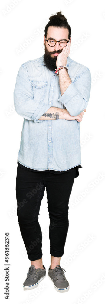 Young hipster man with long hair and beard wearing glasses thinking looking tired and bored with depression problems with crossed arms. Young hipster man with long hair and beard wearing glasses thinking looking tired and bored with depression problems with crossed arms.