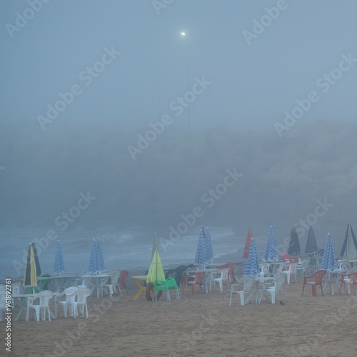 The Asilah or Assilah beach on a summer foggy morning. Moroccan beach on the Atlantic ocean at dawn.