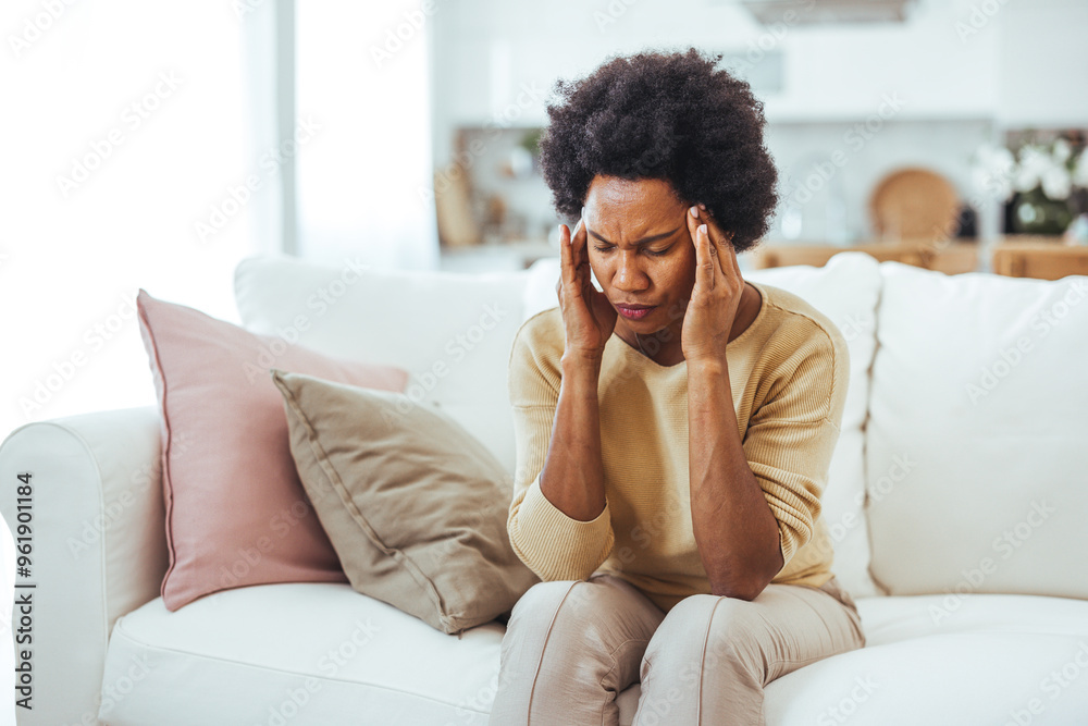 Frustrated Woman Experiencing Headache on Comfortable Couch Frustrated Woman Experiencing Headache on Comfortable Couch
