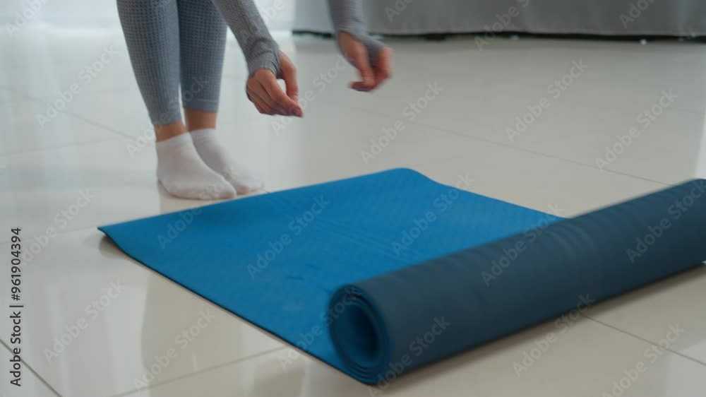 Unrecognizable woman roll out yoga mat on floor yogi fitness trainer sportswoman athlete sport girl at home training exercise gymnastic equipment start healthy morning workout meditation female feet