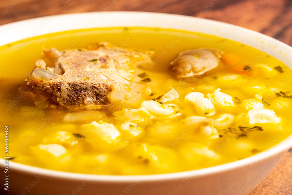 Close up to a bowl of soup Traditional Bolivian food, pork soup called fricase, Close up to a bowl of soup Traditional Bolivian food, pork soup called fricase,