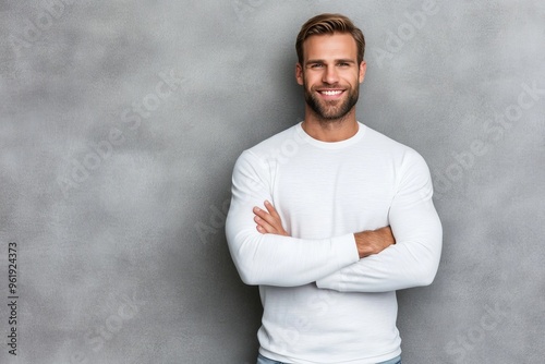 In casual style, arms crossed, denim and shirt with happy model in clothing outfit for chilling, comfort or relaxation on gray background with portrait of man in studio. photo