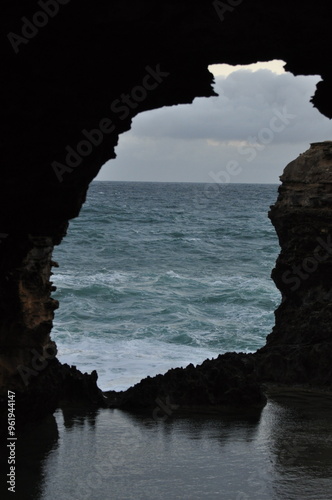 View of the coastal rock arch in Port Campbell National Park near the Great Ocean Road, Australia photo