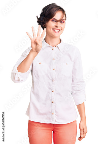 Beautiful young woman with short hair wearing elegant white shirt showing and pointing up with fingers number four while smiling confident and happy.
