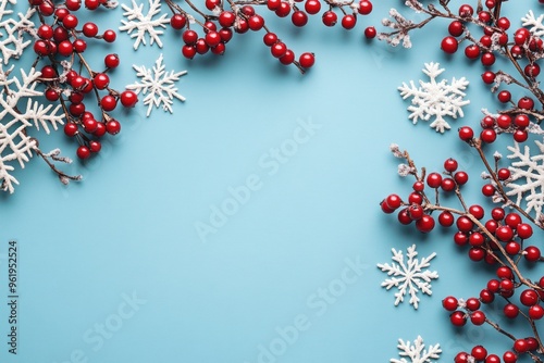 Red Berries and Snowflakes on a Blue Background