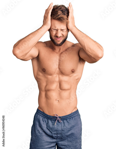 Fotografie Young caucasian man standing shirtless suffering from headache desperate and stressed because pain and migraine