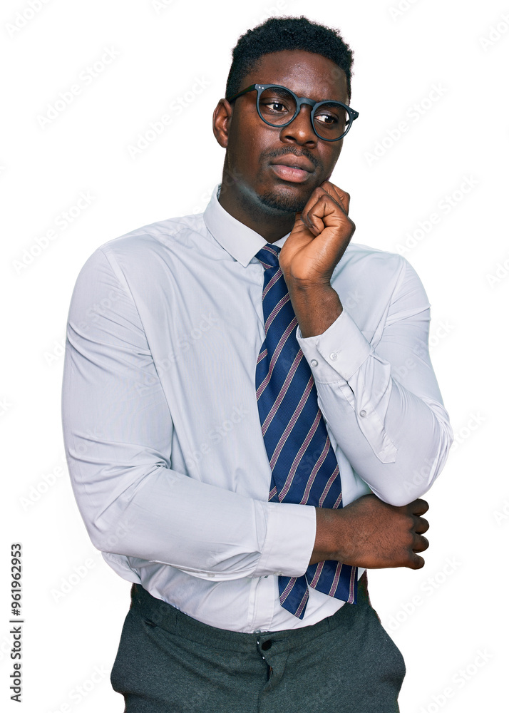Handsome business black man wearing white shirt and tie serious face thinking about question with hand on chin, thoughtful about confusing idea Handsome business black man wearing white shirt and tie serious face thinking about question with hand on chin, thoughtful about confusing idea