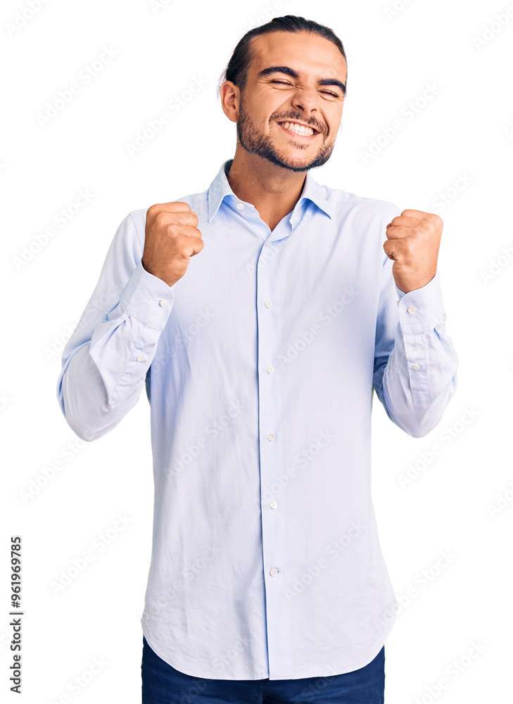 Young handsome man wearing business clothes excited for success with arms raised and eyes closed celebrating victory smiling. winner concept. Young handsome man wearing business clothes excited for success with arms raised and eyes closed celebrating victory smiling. winner concept.