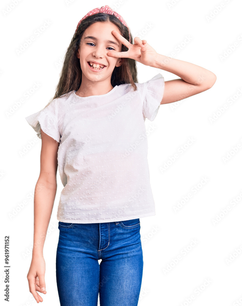 Cute hispanic child girl wearing casual white tshirt doing peace symbol with fingers over face, smiling cheerful showing victory Cute hispanic child girl wearing casual white tshirt doing peace symbol with fingers over face, smiling cheerful showing victory