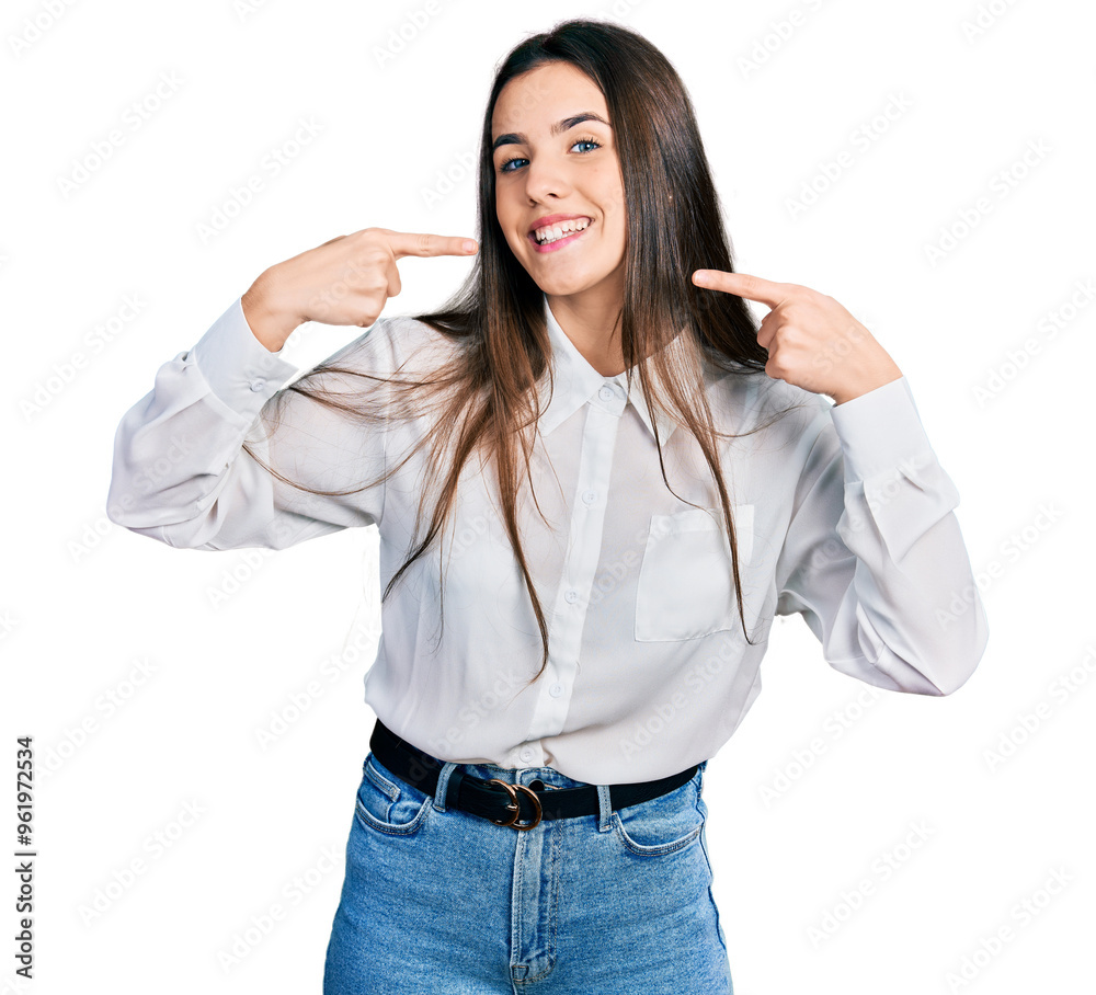 Young brunette teenager wearing business white shirt smiling cheerful showing and pointing with fingers teeth and mouth. dental health concept. Young brunette teenager wearing business white shirt smiling cheerful showing and pointing with fingers teeth and mouth. dental health concept.