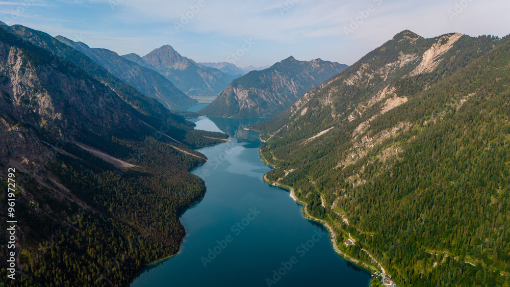 Breathtaking aerial view of the scenic Plansee lake nestled in the mountains of Austria Breathtaking aerial view of the scenic Plansee lake nestled in the mountains of Austria