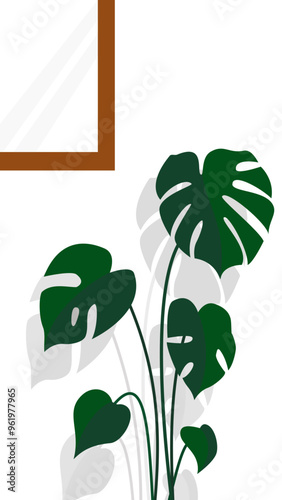 The plant stands against a clean white backdrop, casting soft grey shadows that suggest a light source from the side. A portion of a brown-framed window or artwork is visible in the upper left corner.