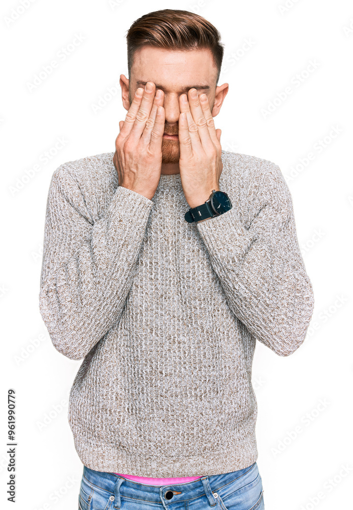 Young redhead man wearing casual winter sweater rubbing eyes for fatigue and headache, sleepy and tired expression. vision problem Young redhead man wearing casual winter sweater rubbing eyes for fatigue and headache, sleepy and tired expression. vision problem