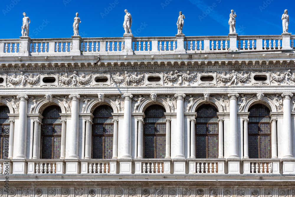 Obraz premium Ornate facade and rooftop statues of Biblioteca Nazionale Marciana in Venice, Italy
