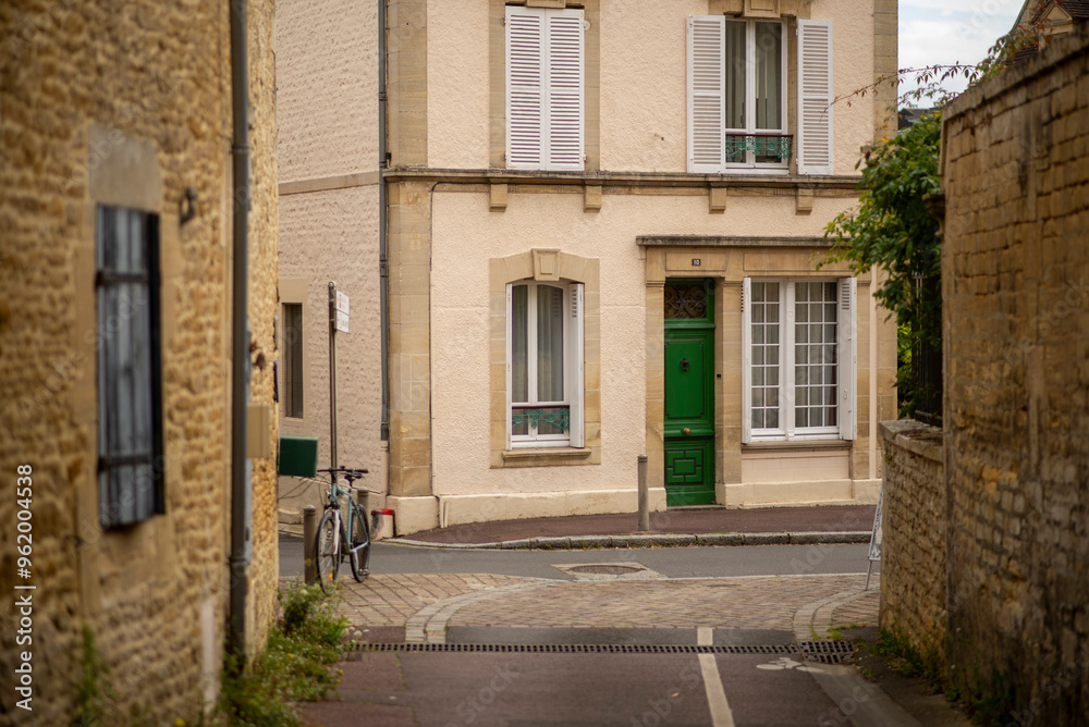 Fototapeta premium Charming european village street with bicycle and historic architecture
