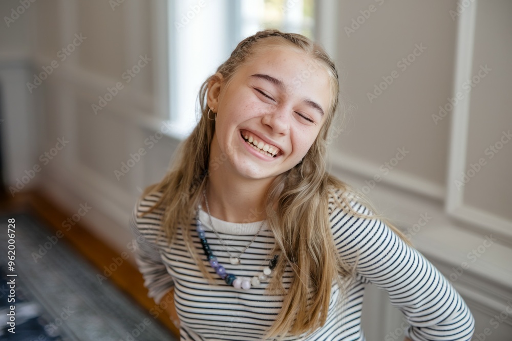 Happy teen girl smiling. Young woman laughs with joy and happiness, conveying positive energy and carefree spirit. Happy teen girl smiling. Young woman laughs with joy and happiness, conveying positive energy and carefree spirit.