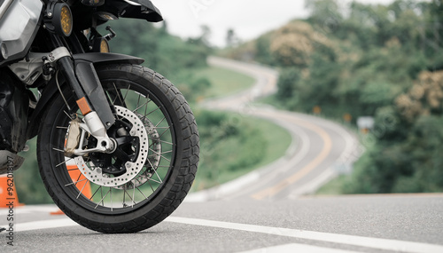 Part of a touring bike Driver's bike. Parking on the street during the day with good light. And there is space to copy space for text.  Road motorcycle touring. motorcycle in a sunny motorbike on th	 