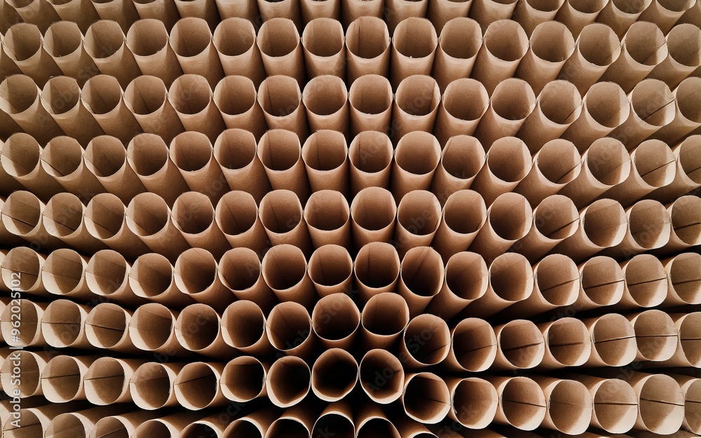 Cardboard tube pattern. Close-up photo of a brown cardboard tube pattern. A geometric design, with repeating shapes. Cardboard tube pattern. Close-up photo of a brown cardboard tube pattern. A geometric design, with repeating shapes.