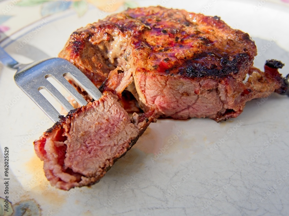Tournedo steaks grilled on charcoal grill medium rare