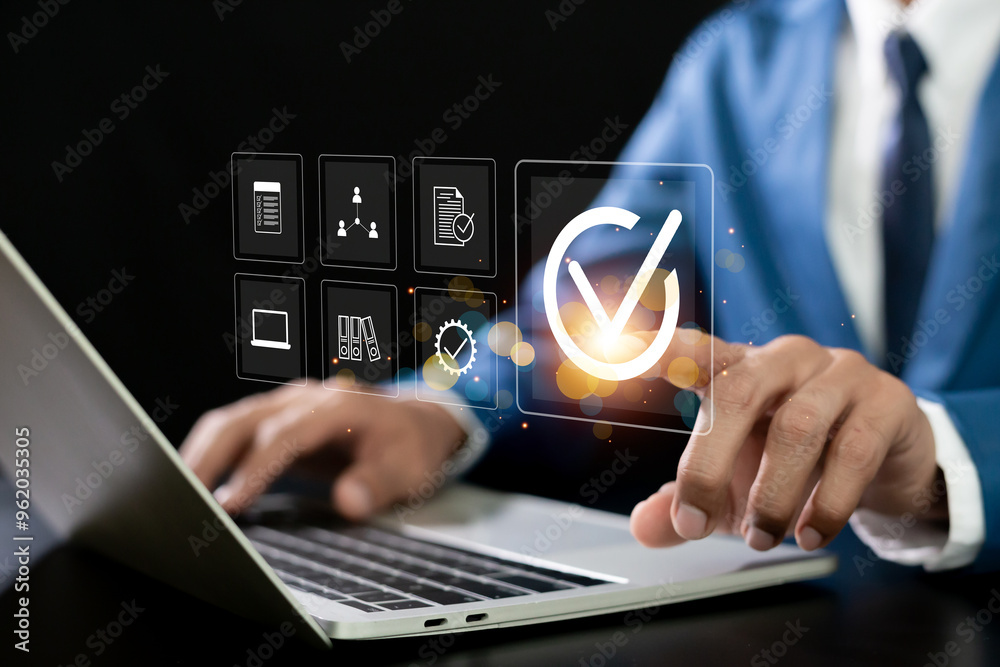 Quality assurance concept. Businessman touching Quality assurance icon on digital screen for ISO certification and standardization. Quality assurance concept. Businessman touching Quality assurance icon on digital screen for ISO certification and standardization.