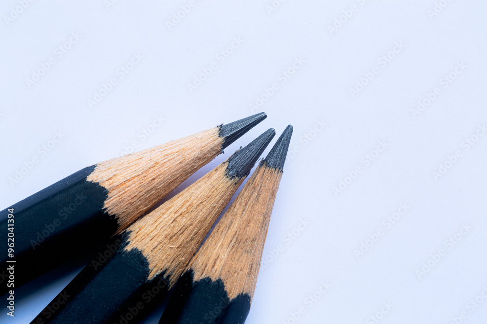 Obraz premium Close-up of a black wooden pencil,The tip of a wooden pencil is seen close up