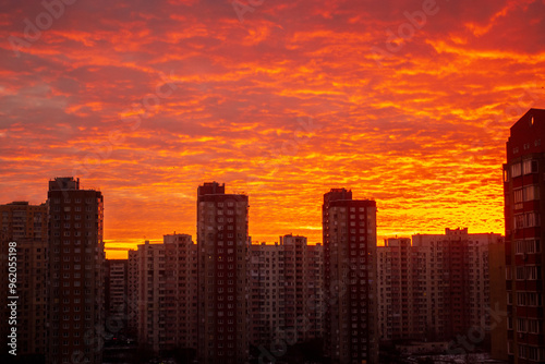 Colorful sunset in red among the sleeping area of high-rise buildings