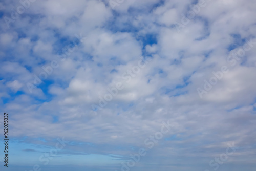 background of blue azure sky with white clouds ideal as a nature or travel backdrop