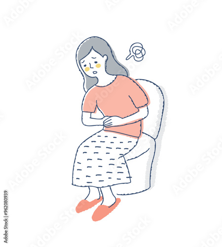 トイレでお腹を押さえている女性　