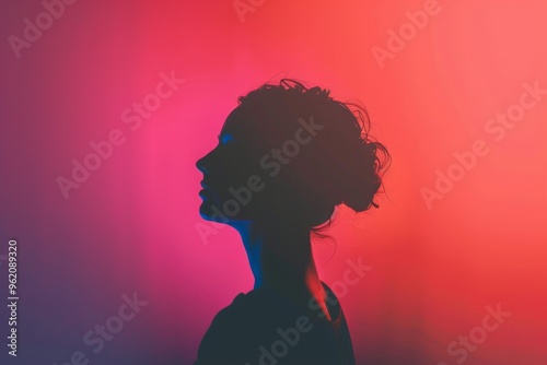 The silhouette of a woman in profile against a gradient background of red and blue.