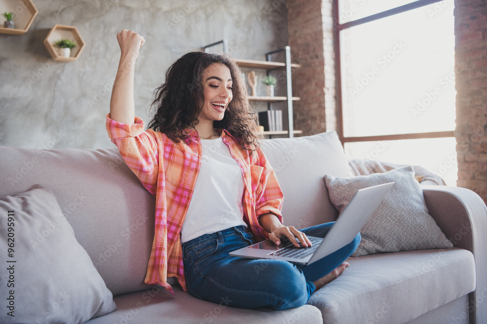 Photo of lucky good mood woman dressed orange shirt winning game modern gadget indoors house apartment room Photo of lucky good mood woman dressed orange shirt winning game modern gadget indoors house apartment room