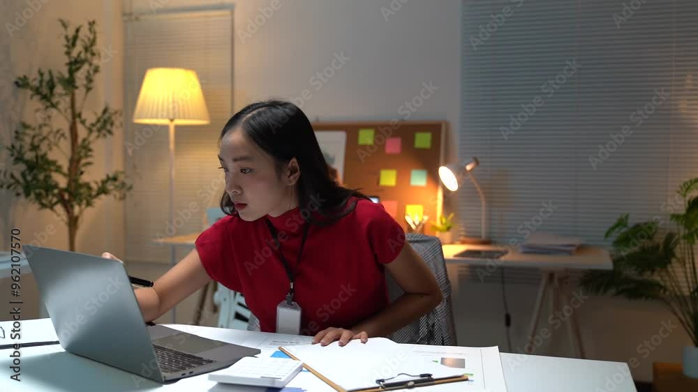 business woman talking using laptop in office. Middle aged Asian female worker looking at computer discussing business plan at office meeting. business woman talking using laptop in office. Middle aged Asian female worker looking at computer discussing business plan at office meeting.