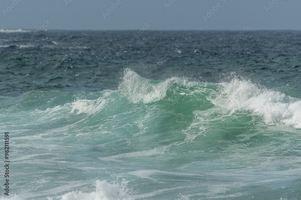 Wave of the green and blue Atlantic Ocean at the edge of a beach in the Iroise Sea. Wave of the green and blue Atlantic Ocean at the edge of a beach in the Iroise Sea.