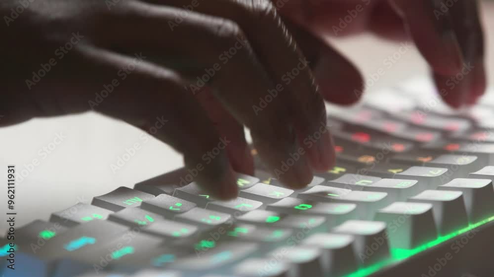 RGB keyboard and hands typing