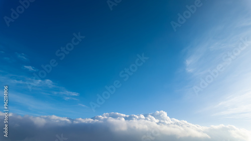 The blue sky with white clouds seen from mountain peak or aeroplane during sunny day. Empty blank copy text space. Concept for heaven.