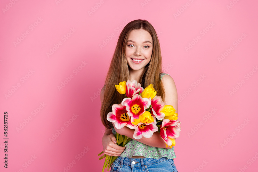 Photo of nice young girl fresh flowers empty space wear top isolated on pink color background Photo of nice young girl fresh flowers empty space wear top isolated on pink color background