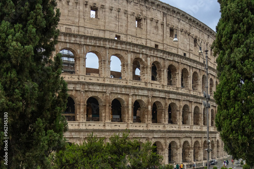 Roman Colosseum, the largest ancient amphitheatre ever built, Italy. Arches, exterior facade. Giardinetto del Monte Oppio. Rome, Italy