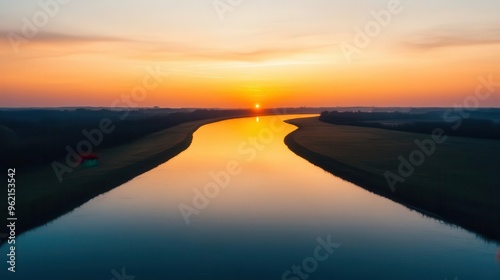 Hazy sunset over a calm river, humid weather, golden hour light