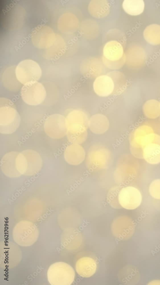 Motion blurred golden shining lights rotate in circle. Abstract bokeh background. Vertical shot Motion blurred golden shining lights rotate in circle. Abstract bokeh background. Vertical shot