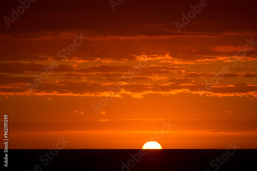 Sun rising over the ocean at Assateague Island National Seashore, Maryland photo