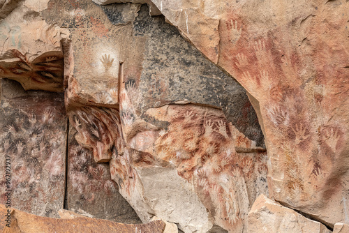 Ancient rock art at Cueva de Las Manos ( Cave of the Hands ) in Santa Cruz Province, Patagonia, Argentina. The art in the cave dates from 9,0001 to 13,000 years ago.