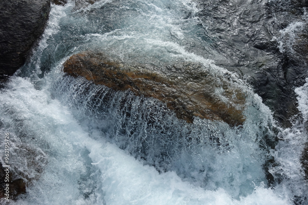 water runs over a rock