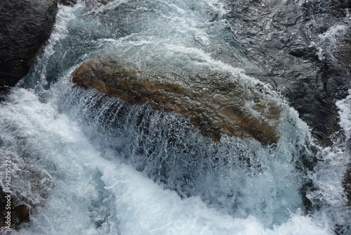 water runs over a rock